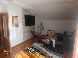 a living room with a couch and a table at Apartments Tutto Bene in Jajce