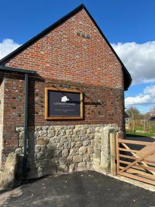a brick building with a sign on the side of it at Ridgeway in Marlborough