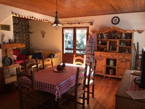 a dining room with a table and some chairs at Chalet de l'Esquirol in Bolquere Pyrenees 2000