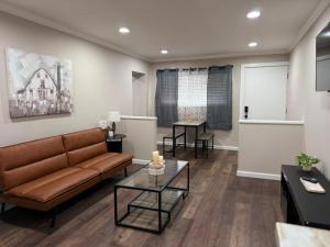 a living room with a couch and a table at The Sandstone Suite in Cleveland