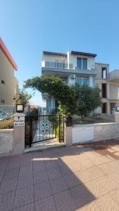 a building with a gate in front of it at Urla Sea View House in Urla