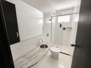 a white bathroom with a sink and a toilet at Hotel Montana Aeroporto by Bsb Inn in Brasília +34 photos