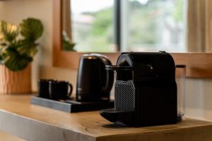 a coffee maker sitting on top of a counter at Astoria Hotel in Troulos