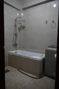 a bathroom with a bath tub and a stove at شقة رويال سويت in Abu Simbel +21 photos
