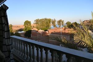 a balcony of a house with a view of the desert at شقة رويال سويت in Abu Simbel