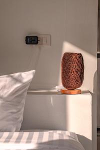 a basket on a shelf next to a bed at Modern Nature Retreat in Ko Phangan +31 photos