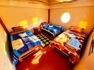 an overhead view of two beds in a room at Salkantay Wasi in Colcapampa +31 photos