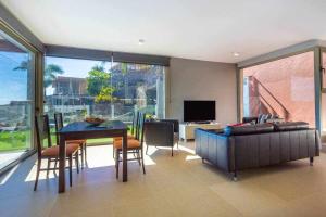 a living room with a couch and a table at Villa Los Dragos Golf by Infinity Summer in San Bartolomé