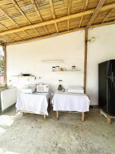 a room with two tables with white sheets on them at Estela, habitación privada de Flor de Lis Beach House in Playas