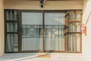 a front door of a store with a sign on it at Beck Apartments - Kitwe in Kitwe