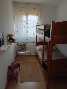 a room with two bunk beds and a window at lugar del pazo nª9-albeos in Albeos