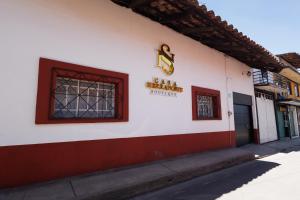 a building with a sign on the side of it at Casa Sierra Norte in Zacatlán