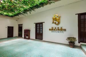 a building with a sign that reads as a million hour district at Casa Sierra Norte in Zacatlán +35 photos