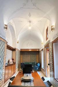 a living room with a table and a couch at bayt el yemin in Kasbah