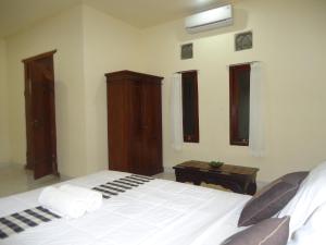Postel nebo postele na pokoji v ubytování Nataliya Homestay