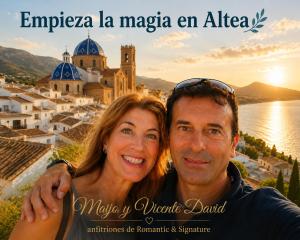 a man and a woman standing in front of a city at Romantic - Garaje Incluido & ApartamentosAltea in Altea