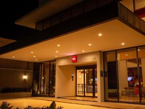 a building with a sign on it at night at ibis Jaú in Jaú