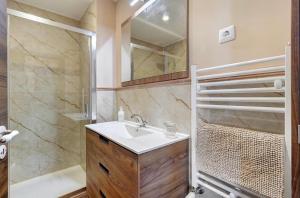 a bathroom with a sink and a shower at Casa do Forno in Ponte da Barca +22 photos