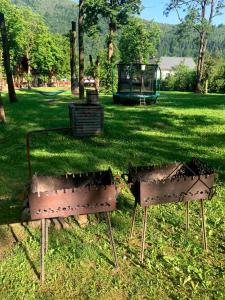a park with a playground in the grass at Готель in Yaremche +3 photos