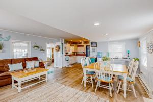 a living room with a table and a couch at Montego Bay - Ocean 13336 in Ocean City