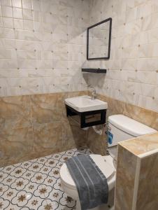 a bathroom with a white toilet and a sink at Pion Hotel Ayutthaya in Phra Nakhon Si Ayutthaya +20 photos