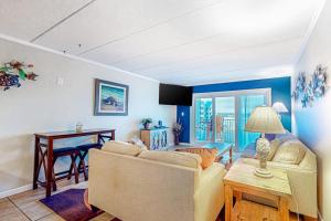a living room with a couch and a table at White Marlin 303B in Ocean City