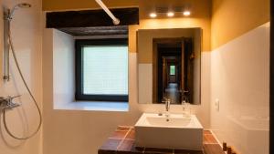 a bathroom with a sink and a mirror at Las Hayucas in San Roque de Ríomiera +27 photos