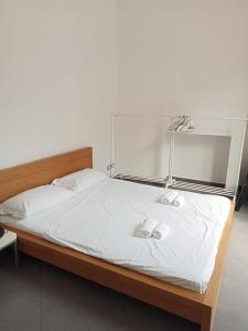 a bedroom with a bed with two towels on it at Bastioni VALE in Pescara