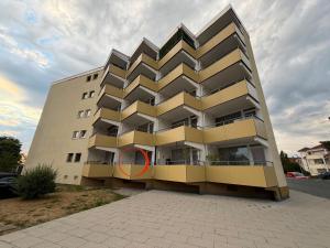 a building with a red circle in front of it at See Sun in Uhldingen-Mühlhofen
