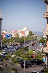 a busy city street filled with lots of cars at 2115 Boutique Hotel in Durrës