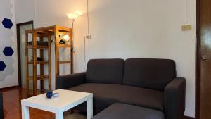 a living room with a couch and a table at Zen Forest in Ko Phangan