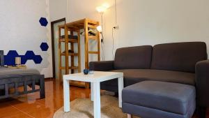 a living room with a couch and a table at Zen Forest in Ko Phangan +20 photos