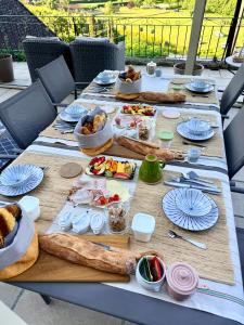 a long table with food on top at Le Coin Tranquille in La Roque-Gageac