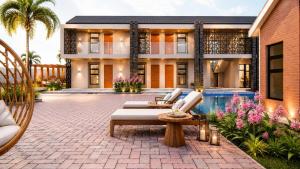 a house with a patio with chairs and a pool at HMT Guest House in Thohoyandou