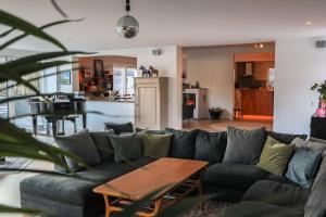 a living room with a couch and a table at Villa Circus in Halmstad