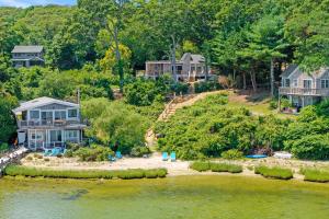 an aerial view of homes on a hill next to a river at Steps to Beach: Martha's Vineyard Private Retreat! in Vineyard Haven