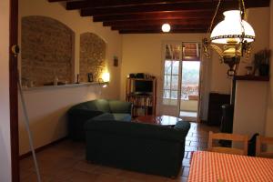 a living room with two chairs and a table at Petit Crecy 