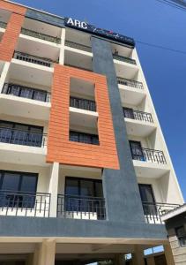 an apartment building with an amr sign on it at Studio apartment at Arc Residence in Nairobi