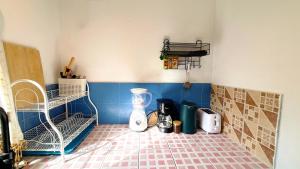 a kitchen with a blender on a tiled floor at Zen Hideaway - Cute Modern Thai Home in Ko Phangan +11 photos