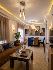 a living room with a couch and a table at atlas golf resort in Marrakesh