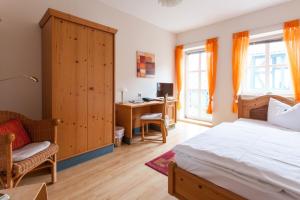 Postel nebo postele na pokoji v ubytování Hotel Am Grudenberg