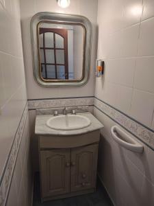 a bathroom with a sink and a mirror at Lo de Delia in City Bell +15 photos