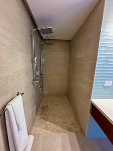 a bathroom with a shower with a towel at Bliss Resort in San Juan del Sur +14 photos