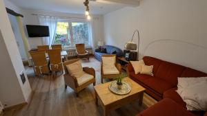 a living room with a couch and a table at Ferienhaus Weserblick in Rinteln