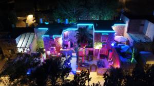 a house decorated with christmas lights at night at Aloni - Guest house Dead Sea in Neve Zohar