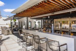 a bar on the roof of a building at Intelier Casa de Indias in Seville