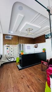 an office with a large room with a wooden floor at Arul Rayara Residency in Mādhavaram