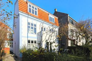 an apartment building with an orange roof at CPH Guest Homes in Copenhagen