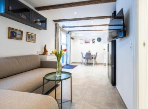 a living room with a couch and a table at CPH Guest Homes in Copenhagen