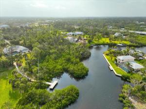 an aerial view of a river with trees and houses at Palm Tree Parasdise in Englewood